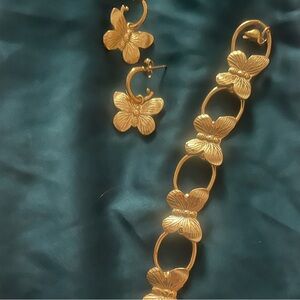 Gold tone butterfly hoop earrings and adjustable bracelet